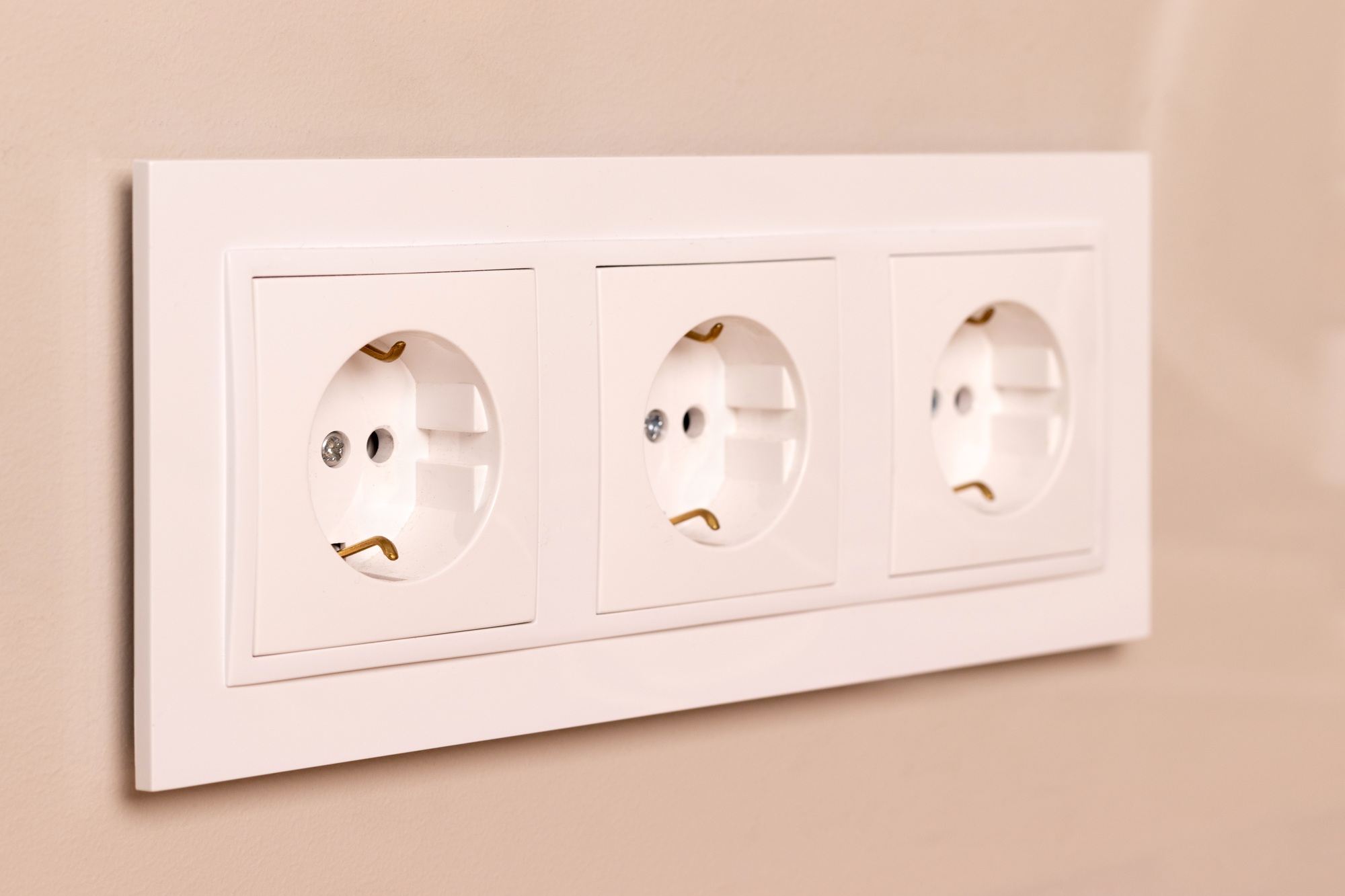 Electrical outlets on beige wall
