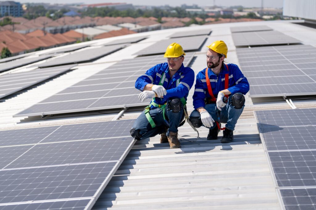 Engineer working setup Solar panel at the roof top. Engineer or worker work on solar panels or solar